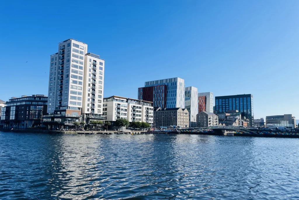 Dublin docklands waterfront under a clear sky